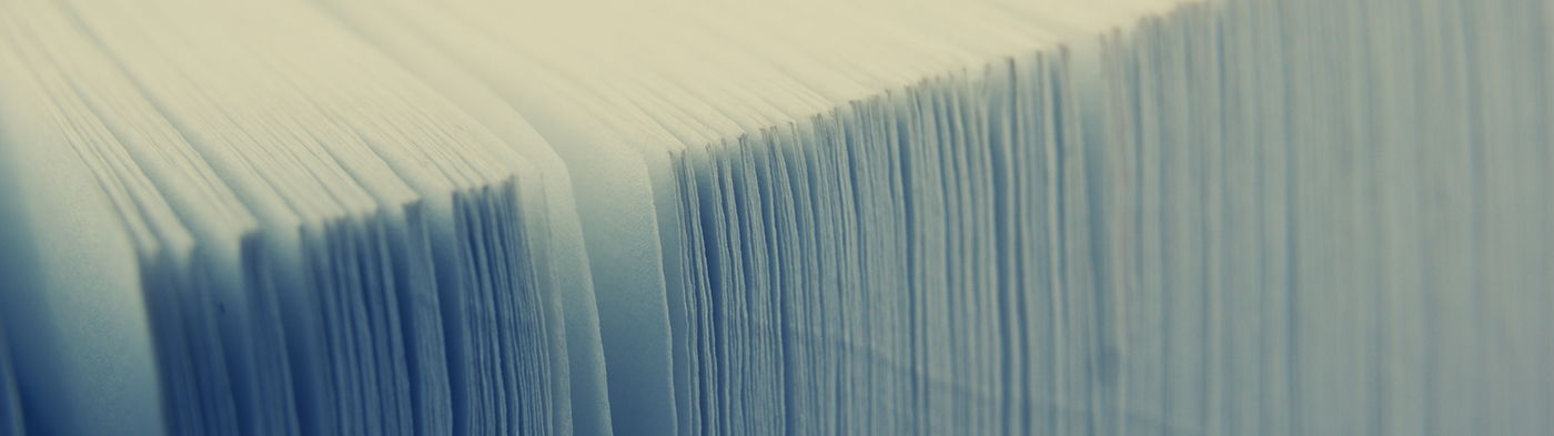 Close up view of a stack of white papers